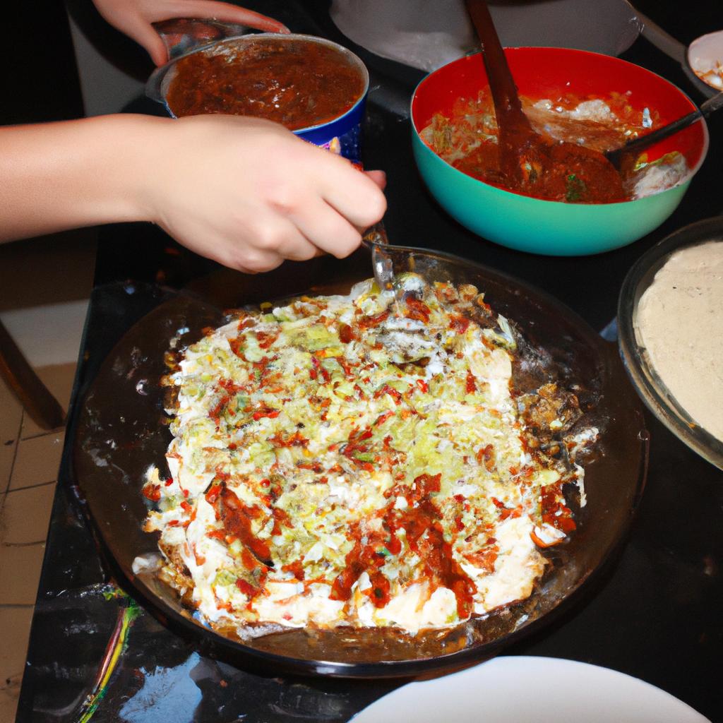 Person cooking enchiladas in kitchen
